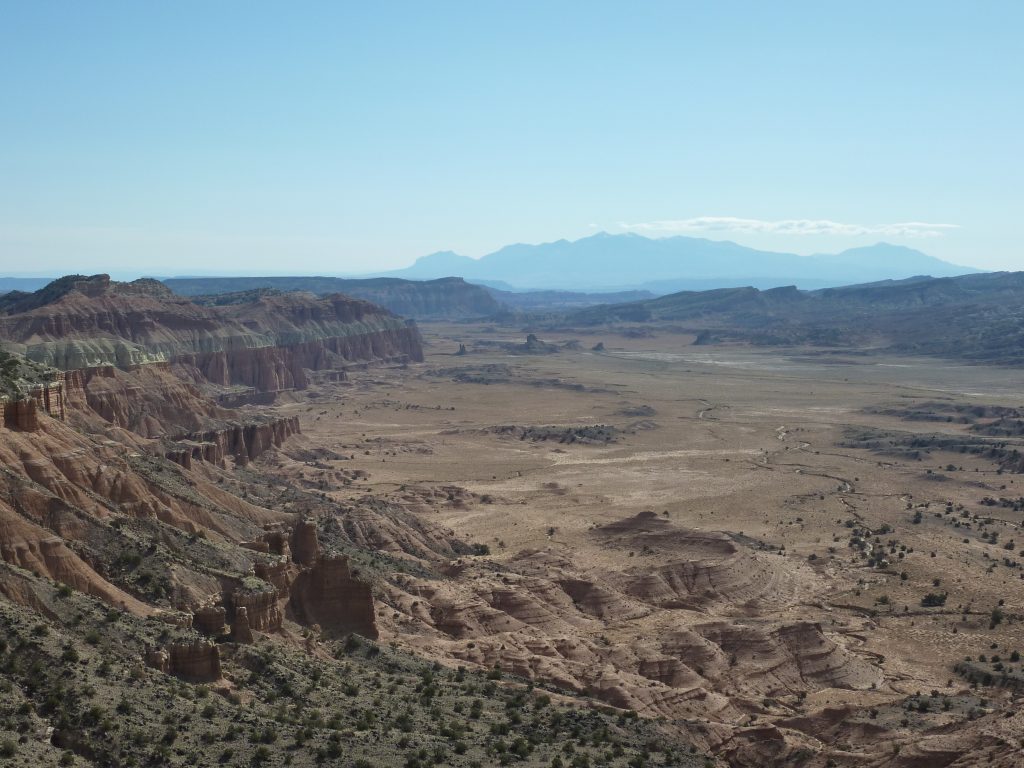 Jeep trail through Upper Cathedral Valley in Capitol Reef National Park, Henry Mountains in the distance