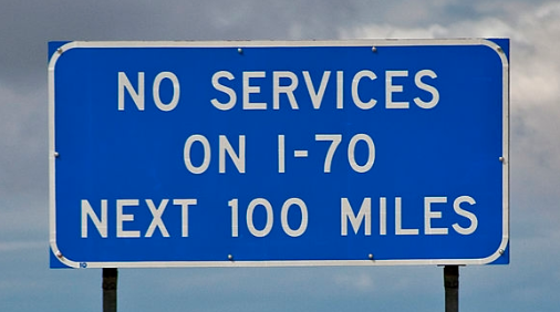 Blue highway sign advising no services
