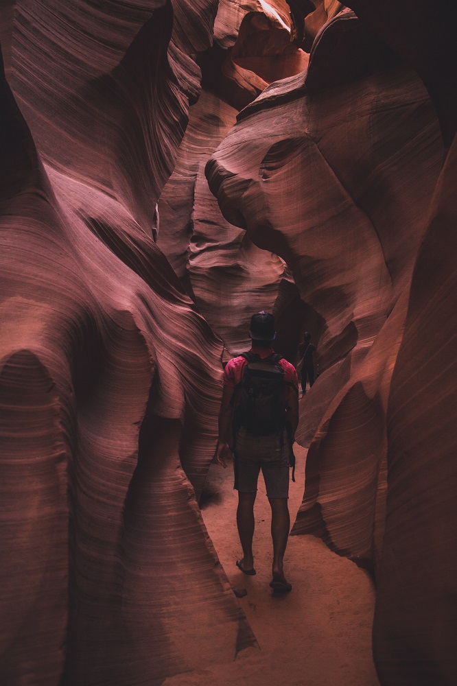 person in narrow canyon