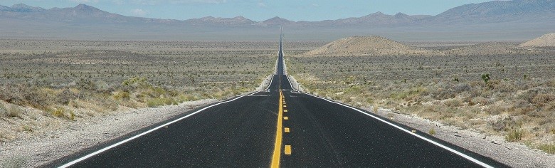 asphalt road through the southwest desert