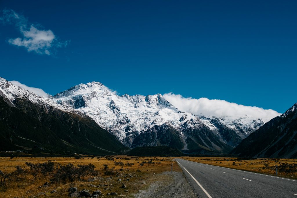 road leading to snowy mountains