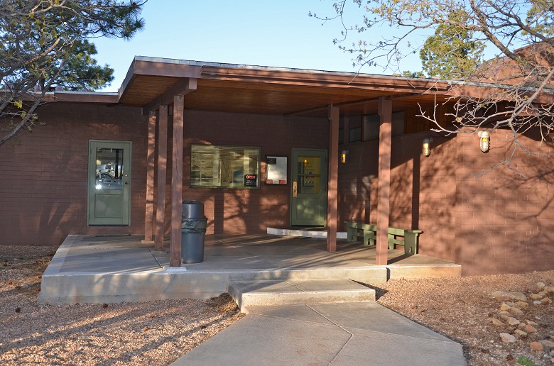 brown building with green doors