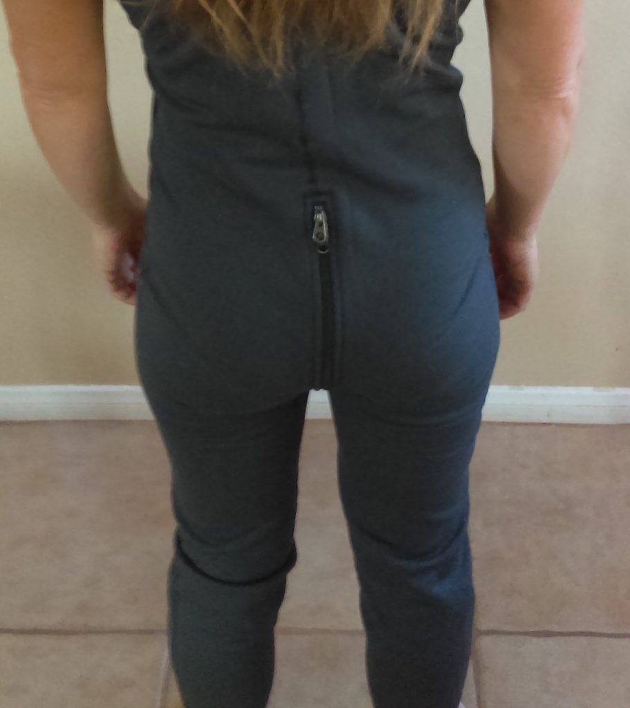 The back of grey fleece overalls with back zipper