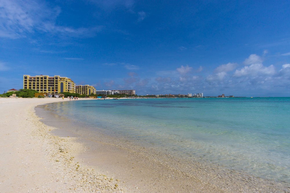 white-sand beach and blue calm seawater