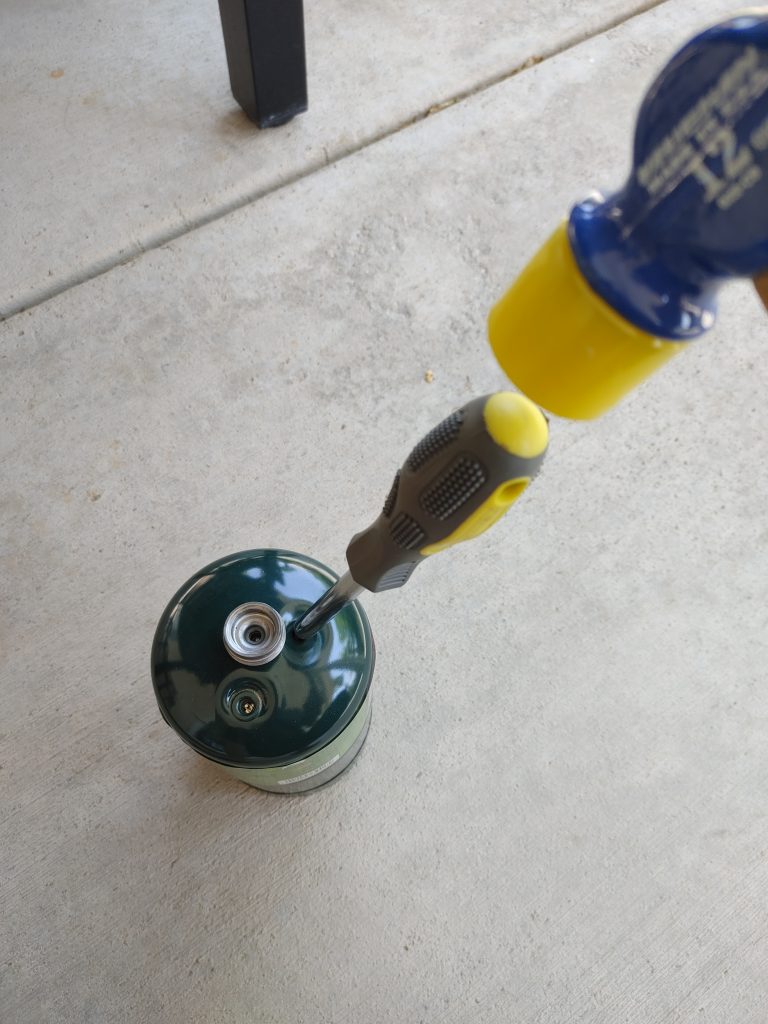 propane cylinder, screwdriver, hammer